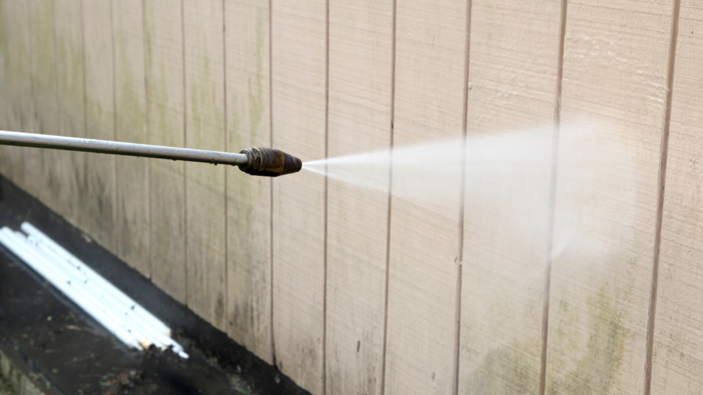 Soft washing mildew off wood siding